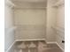 Walk-in closet featuring ample shelving and neutral carpeting at 1116 Powder, Fuquay Varina, NC 27526