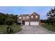 Charming two-story brick home featuring a two car garage, manicured lawn, and classic architectural details at 1116 Powder, Fuquay Varina, NC 27526