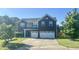 Traditional two-story home with a two-car garage and manicured front lawn at 1116 Powder, Fuquay Varina, NC 27526
