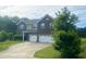 Traditional two-story home with a two-car garage and manicured front lawn at 1116 Powder, Fuquay Varina, NC 27526