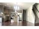 Bright kitchen with stainless steel appliances, granite countertops, and a stylish island, perfect for cooking and entertaining at 1116 Powder, Fuquay Varina, NC 27526