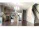 Open kitchen with stainless steel appliances, granite countertops, and a central island at 1116 Powder, Fuquay Varina, NC 27526