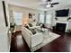 Cozy living room featuring a fireplace, plush seating, large windows, and elegant decor for comfortable living at 1116 Powder, Fuquay Varina, NC 27526