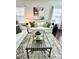 Bright living room with comfortable seating, a glass coffee table, and neutral decor, creating a relaxing and stylish space at 1116 Powder, Fuquay Varina, NC 27526