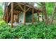 Covered patio and staircase below the deck with garden at 112 Hidden Bluff Ln, Cary, NC 27513