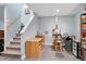 Finished basement provides an art studio with an easel, desk, and stairway access at 112 Hidden Bluff Ln, Cary, NC 27513