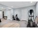 Finished basement featuring exercise equipment and carpet floors at 112 Hidden Bluff Ln, Cary, NC 27513