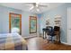 Bedroom with hardwood floors, two windows and a desk, perfect for a home office at 112 Hidden Bluff Ln, Cary, NC 27513