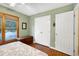 This bedroom boasts hardwood floors and a double-door closet for ample storage at 112 Hidden Bluff Ln, Cary, NC 27513