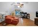 Bonus room featuring an arm chair and built-in bookcase and a hardwood floor at 112 Hidden Bluff Ln, Cary, NC 27513