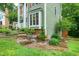 Inviting two-story home featuring charming brick-lined landscaping with decorative stone steps at 112 Hidden Bluff Ln, Cary, NC 27513
