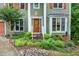 Charming front yard featuring rock garden, beautiful landscaping and a traditional style door at 112 Hidden Bluff Ln, Cary, NC 27513
