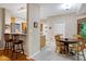 Open layout with breakfast nook and counter with bar stool seating at 112 Hidden Bluff Ln, Cary, NC 27513