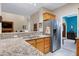 Open kitchen with granite counters, stainless appliances and breakfast bar at 112 Hidden Bluff Ln, Cary, NC 27513