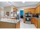Spacious kitchen with stainless appliances, tile flooring, and access to dining room at 112 Hidden Bluff Ln, Cary, NC 27513