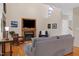 Inviting living room features a cozy fireplace with built-in TV, and a vaulted ceiling with lots of natural light at 112 Hidden Bluff Ln, Cary, NC 27513