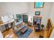 Open-concept living room with soaring ceilings, hardwood floors, and floor-to-ceiling windows with an adjacent dining area at 112 Hidden Bluff Ln, Cary, NC 27513