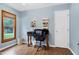 Office space with hardwood floors, natural light, and a desk at 112 Hidden Bluff Ln, Cary, NC 27513