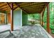 Cozy under-deck patio provides a relaxing outdoor space with stone pavers and swing chair at 112 Hidden Bluff Ln, Cary, NC 27513