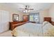 Cozy bedroom features a ceiling fan, and wood furnishings, creating a warm, inviting space at 115 Spring Branch Dr, Four Oaks, NC 27524