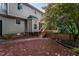 Exterior view of a two-story home with a wooden deck and landscaped backyard at 11816 Stannary Pl, Raleigh, NC 27613