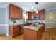 Kitchen featuring stainless steel appliances, granite counters, and a center island at 11816 Stannary Pl, Raleigh, NC 27613