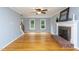 Living room with fireplace, hardwood floors, ceiling fan and lots of natural light at 11816 Stannary Pl, Raleigh, NC 27613