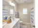 Neutral bathroom with double sink vanity, large mirror, and tub-shower combo at 1205 Cosmic Dr, Durham, NC 27703