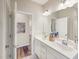 Bright bathroom featuring dual sinks, modern fixtures, and stylish decor at 1205 Cosmic Dr, Durham, NC 27703