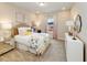 Bright bedroom with a floral bedspread, pink curtains, and a window with a view of the outdoors at 1205 Cosmic Dr, Durham, NC 27703