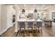 Modern kitchen with stainless steel appliances, quartz countertops, and barstool seating at the island at 1205 Cosmic Dr, Durham, NC 27703