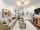Cozy living room featuring a large sectional sofa, wood coffee tables, and stylish decor at 1205 Cosmic Dr, Durham, NC 27703