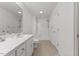 All-white bathroom offers a single sink vanity, a shower, and a toilet at 12449 W Pamlico St, Middlesex, NC 27557