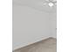 Simple bedroom features a white ceiling fan, closet and carpet at 12449 W Pamlico St, Middlesex, NC 27557