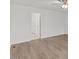 Bright bedroom features neutral walls, hardwood floors, ceiling fan with a light and adjoined bathroom at 12449 W Pamlico St, Middlesex, NC 27557