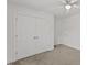 Bright bedroom features double closet doors and a ceiling fan at 12449 W Pamlico St, Middlesex, NC 27557