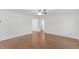 Bright living room with hardwood floors, a ceiling fan, and fresh white walls at 12449 W Pamlico St, Middlesex, NC 27557