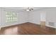 Bright and airy living room with hardwood floors, a ceiling fan, and a window at 12449 W Pamlico St, Middlesex, NC 27557