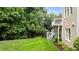 This fully landscaped backyard features a deck, patio, and lush grass at 13121 Sargas St, Raleigh, NC 27614