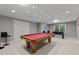Finished basement with a pool table, foosball table, and recessed lighting at 13121 Sargas St, Raleigh, NC 27614