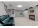 Finished basement area features a fireplace, neutral carpeting, and outside access at 13121 Sargas St, Raleigh, NC 27614