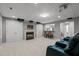 Finished basement with fireplace, movie projector, and seating area at 13121 Sargas St, Raleigh, NC 27614