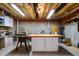 Unfinished basement with workbench, storage cabinets, and exposed ceiling at 13121 Sargas St, Raleigh, NC 27614