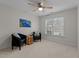Bedroom with neutral carpet, seating area, and natural light from the window at 13121 Sargas St, Raleigh, NC 27614