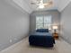 Cozy bedroom with a comfortable bed, plush carpeting, and a large window at 13121 Sargas St, Raleigh, NC 27614