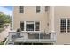 Deck with grill, table, and chairs overlooking the backyard at 13121 Sargas St, Raleigh, NC 27614