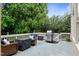 Deck area with seating, side table, and a grill at 13121 Sargas St, Raleigh, NC 27614