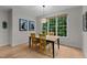 Cozy dining area with a simple table and chairs, and a large window offering a view at 13121 Sargas St, Raleigh, NC 27614