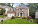 Beautiful two-story brick home with dark shutters, manicured lawn, and an attached two-car garage at 13121 Sargas St, Raleigh, NC 27614