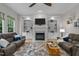 Inviting living room with fireplace, custom built-ins, and comfortable seating at 13121 Sargas St, Raleigh, NC 27614